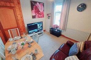 House | Living room | 30-inch TV with cable channels