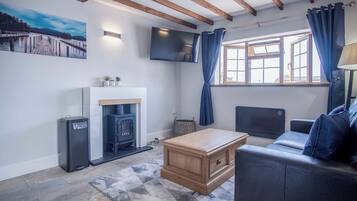 32-inch flat-screen TV with cable channels, TV