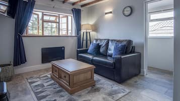 32-inch flat-screen TV with cable channels, TV