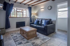 Televisión de pantalla plana de 32 pulgadas con canales por cable