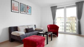 Deluxe Apartment | Living area | 40-inch flat-screen TV with digital channels, TV