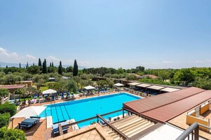 Outdoor pool, open 9:00 AM to 6:00 PM, pool umbrellas, sun loungers
