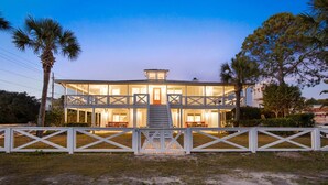 A two-story house with a balcony, a front porch, and a staircase leading to the entrance. - Private Pool | LSV | 2 Min Walk to Beach (Santa Rosa Beach)