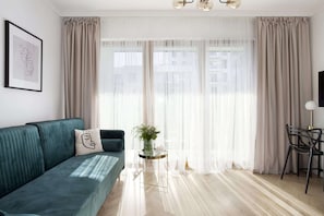 Design Apartment | Living area | 40-inch flat-screen TV with digital channels, TV