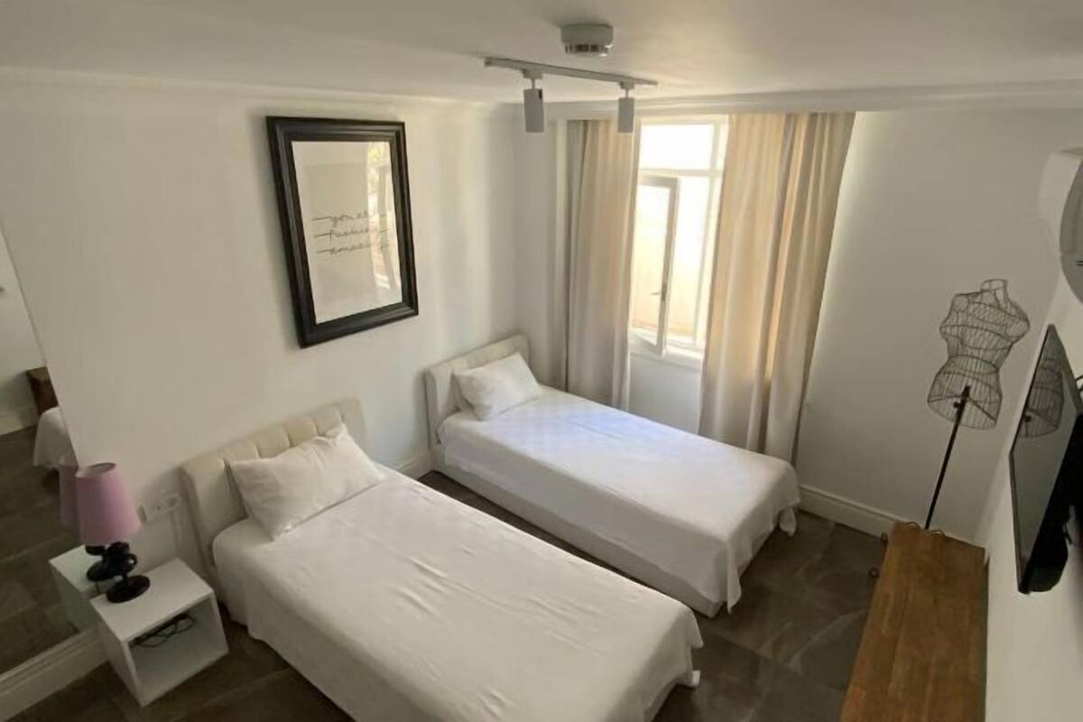 Blackout curtains, soundproofing, iron/ironing board (on request)