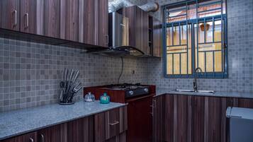 Fridge, toaster, cookware/dishes/utensils, spices