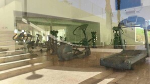 A gym with various exercise equipment including treadmills and stationary bikes. - COMFORTABLE APARTMENT WITH POOL, WHIRLPOOL BATHTUB, 70" TV AND MORE (Cabo San Lucas)