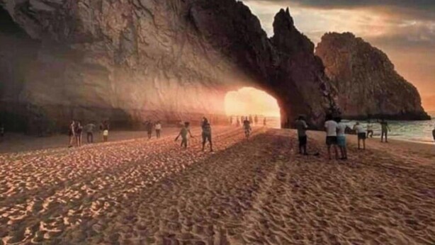 A beach with a large rock formation and people walking on the sand. - COMFORTABLE APARTMENT WITH POOL, WHIRLPOOL BATHTUB, 70" TV AND MORE (Cabo San Lucas)