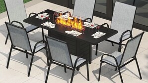 A rectangular outdoor dining table with chairs, a built-in fire feature, and a glass-top surface. - Fox Valley Farmhouse by the river - walk to town & pool (St. Charles)