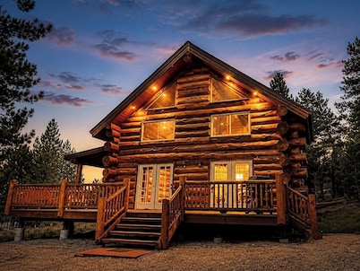 Custom log cabin tucked away in private forest
