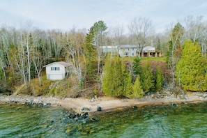 Escape to a serene lakeside haven surrounded by a dense forest, perfect for relaxation and outdoor activities.