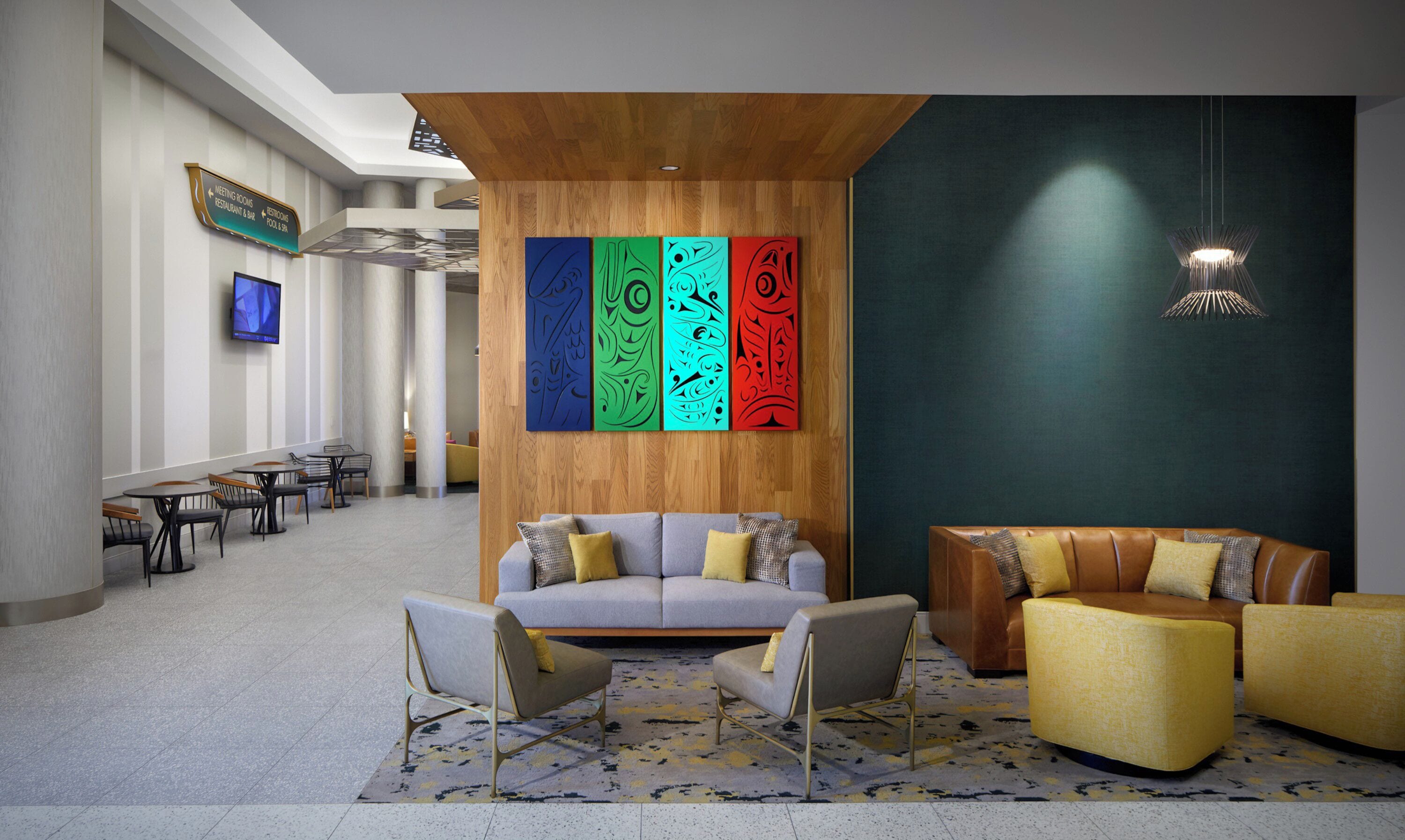 A modern lobby with a gray sofa, yellow armchairs, and a wooden accent wall with colorful artwork.