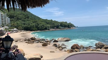 On the beach, sun-loungers, beach towels