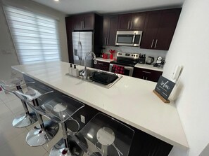 Full-sized fridge, microwave, oven, stovetop - Breathtaking Sky Terrace 4BR/4BA BBQ/BAR  - New Home  (Homestead)