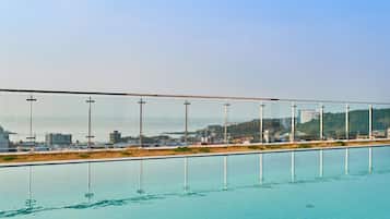 Outdoor pool, open 3:00 PM to 9:00 PM, pool loungers