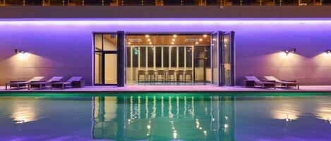 Outdoor pool, open 3:00 PM to 9:00 PM, pool loungers