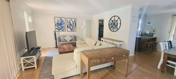 Flat-screen TV, DVD player, books