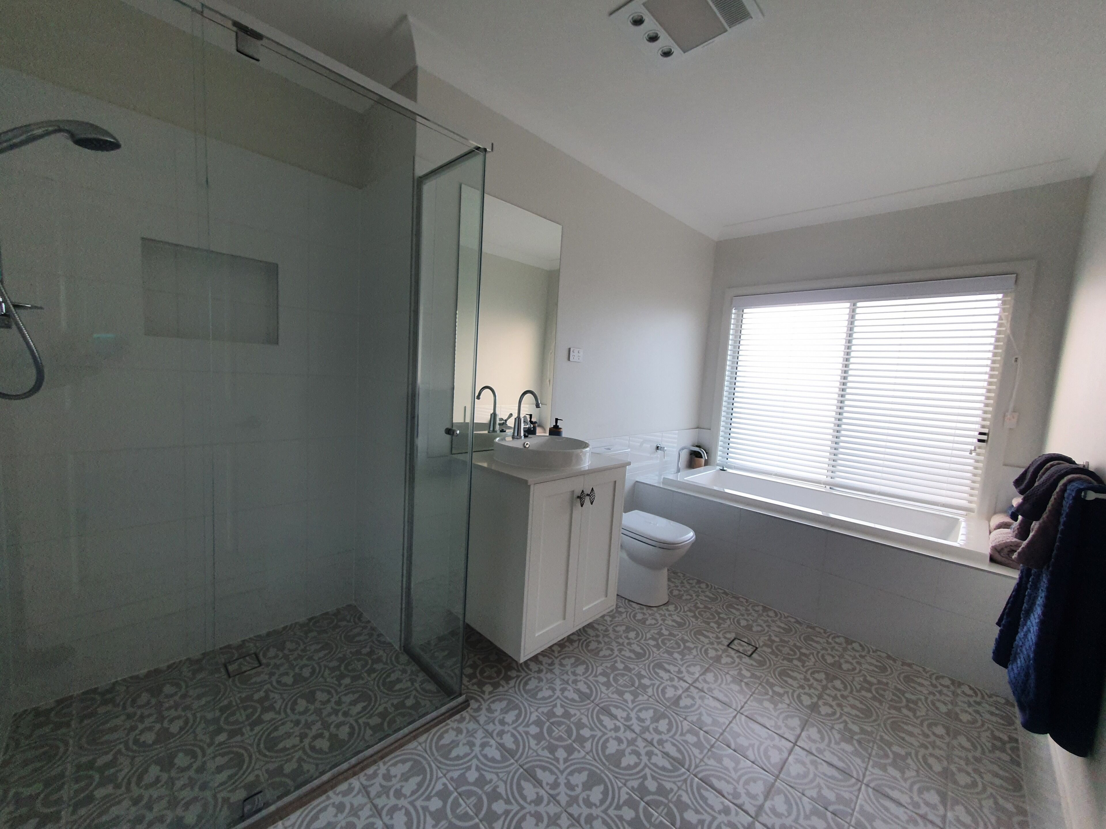 Bathtub, hair dryer, towels, soap