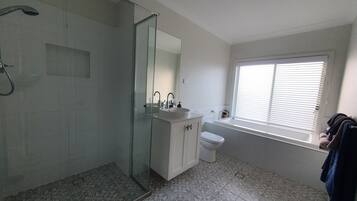 Bathtub, hair dryer, towels, soap