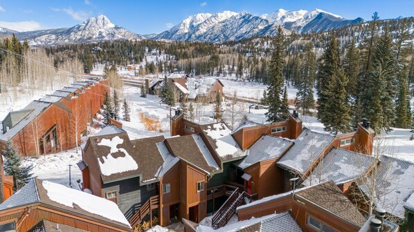 A snow-covered lodge with multiple buildings, a ski lift, and a mountainous backdrop. - Great Value, Hot Tub, Hiking/Fishing Close! (Durango)