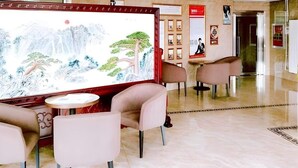 A lobby with a large traditional painting, comfortable seating, and a polished floor. - Greentree Alliance Beijing Shunyi District Xiaoying Hotel (Shunyi)