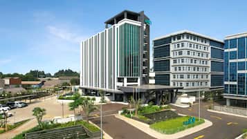 Stylish hotel complex with a sleek glass facade and modern architecture.