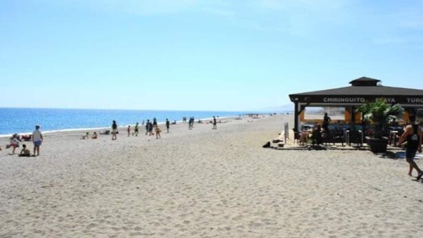 A beach with a covered area labeled 'CHIRINGUITO'. - Extraordinary duplex in Naturist area (Vera)