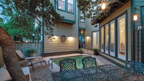 A patio area with a pool, outdoor seating, and a covered section with a grill. - Private Pool, Easy Walk to Beach, 5 Bikes + Free Dolphin Cruise! (Santa Rosa Beach)