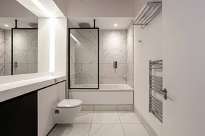 Bathtub, hair dryer, towels, soap