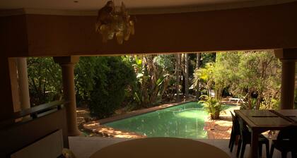 Aloha Lodge spacious bedroom, sleeps 2, with its own entrance and  a garden view