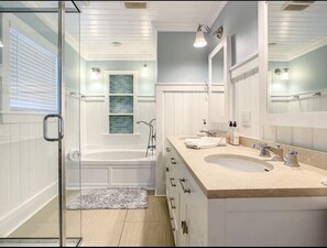 Bathtub, hair dryer, towels, soap