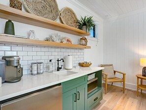 Fridge, microwave, coffee/tea maker, dining tables