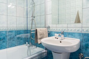 Combined shower/tub, hair dryer, towels, soap