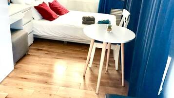 1 bedroom, desk, iron/ironing board, travel crib