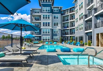 A year-round heated pool and jacuzzi overlooking the waterfront is a perfect way to relax with family and friends