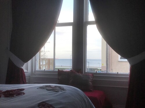 A spacious house in an ideal location, across the road from the beach.
