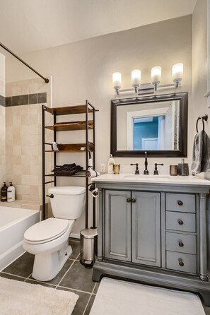 Combined shower/bathtub, hair dryer, towels, soap