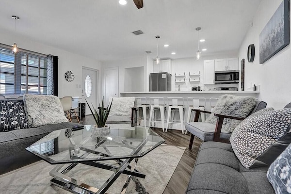 This is the living room. The space is cozy. It is also comfortable.