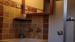 A bathroom with a sink, two faucets, a cup holder, and a mirror. - More from lárlequí - Entire farmhouse (Rojals)
