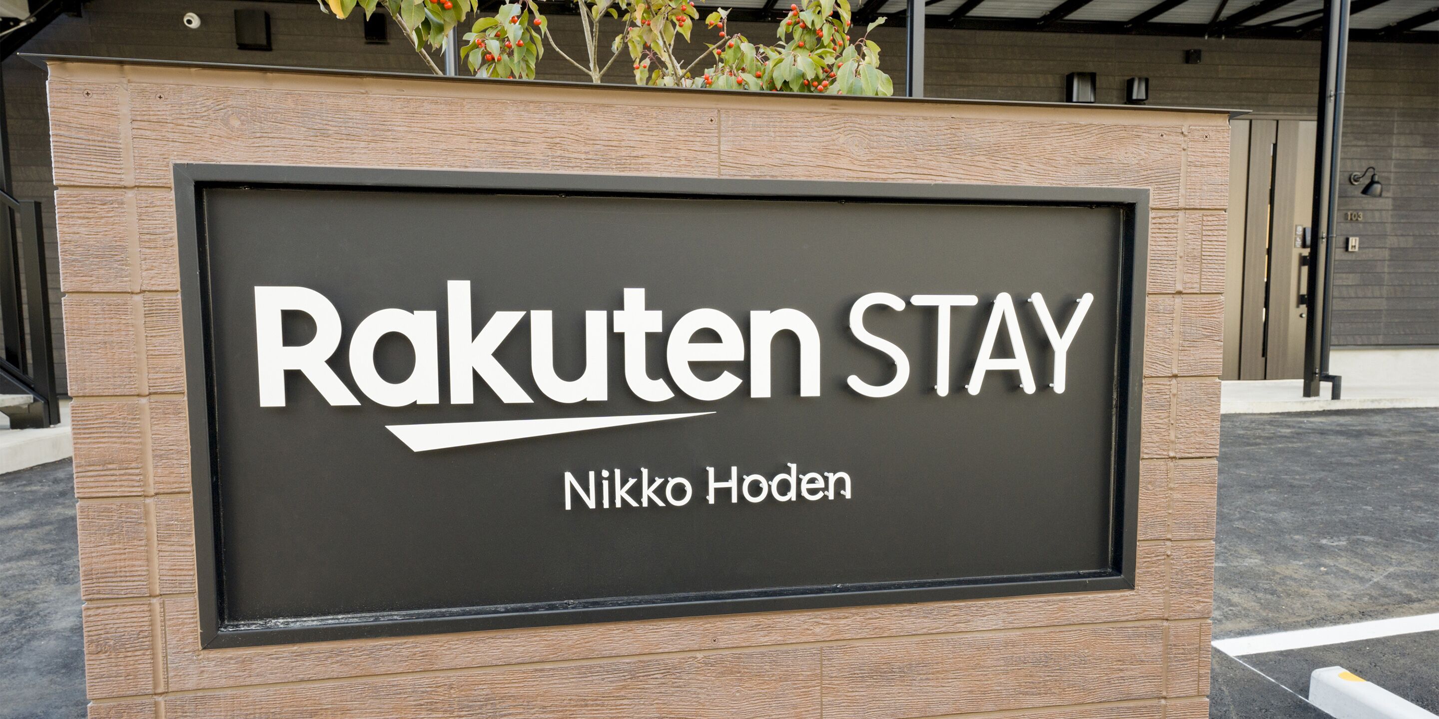 A sign for Rakuten Stay at Nikko Hoden.