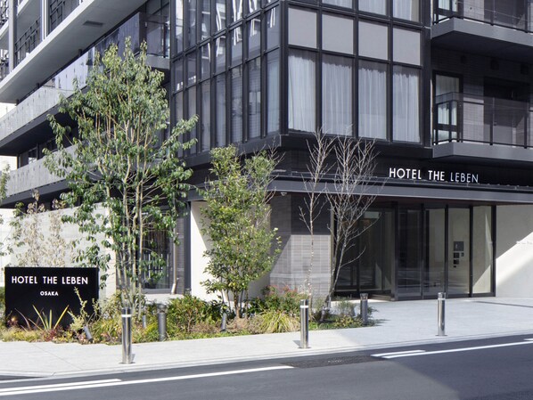 A modern hotel with a prominent sign reading "HOTEL THE LEBEN" and "OSAKA". - Hotel THE LEBEN OSAKA (Osaka)