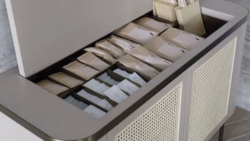 A storage unit with multiple compartments, some containing papers and others with bags.