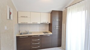 Apartamento | Cozinha privada | Geladeira grande
