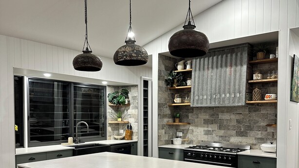 A modern kitchen with a large island, stainless steel appliances, and pendant lighting. - Riverfront Farm Stay with Animal Nursery at The Hatch Farm, Port Macquarie (Blackmans Point)