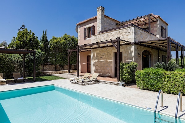 A heated pool, pool loungers
