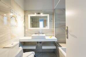 Shower, hair dryer, towels, toilet paper