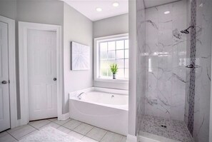 Combined shower/bathtub, hair dryer, towels, soap