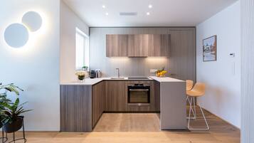 Fridge, microwave, stovetop, coffee/tea maker
