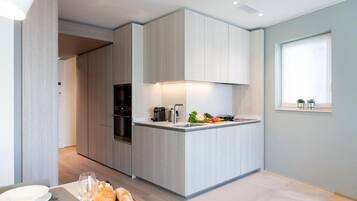 Fridge, microwave, stovetop, coffee/tea maker