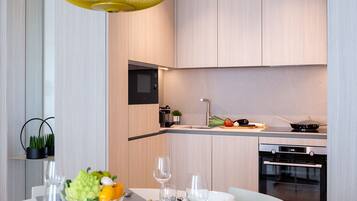 Fridge, microwave, stovetop, coffee/tea maker